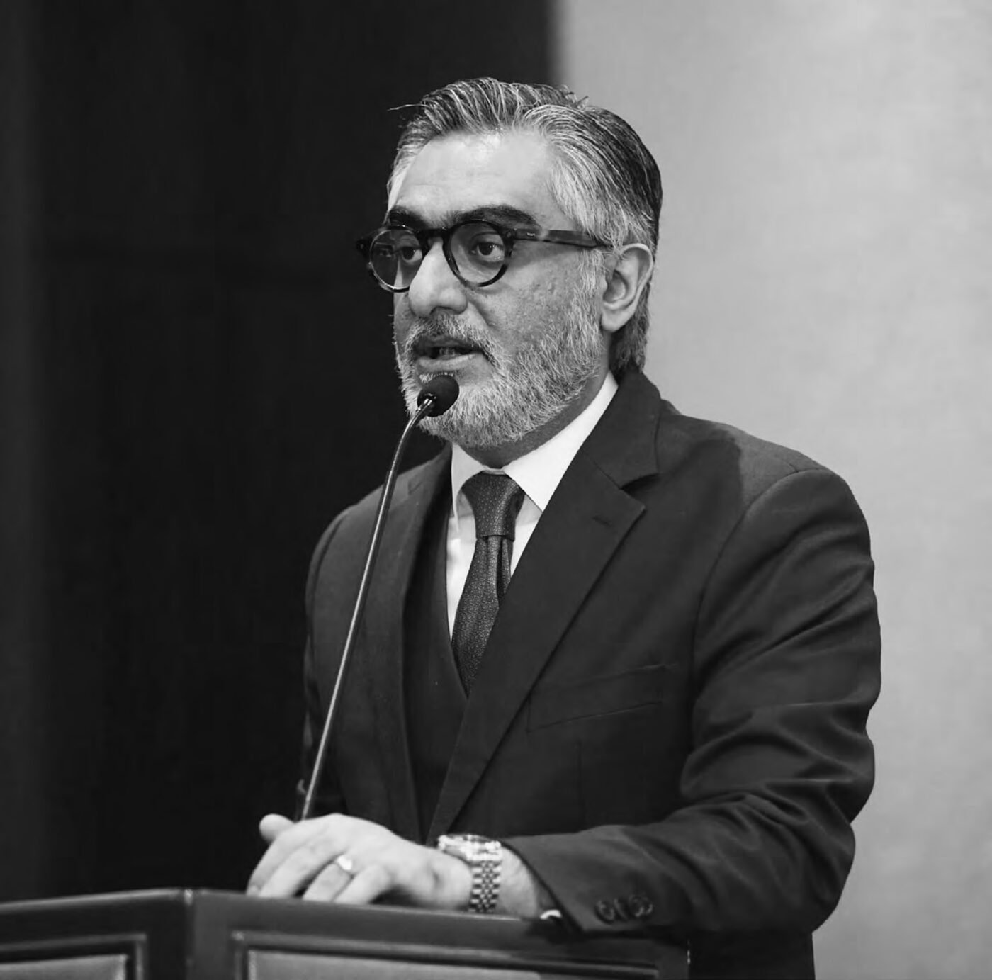 Shafaat Hashmi speaking at a podium